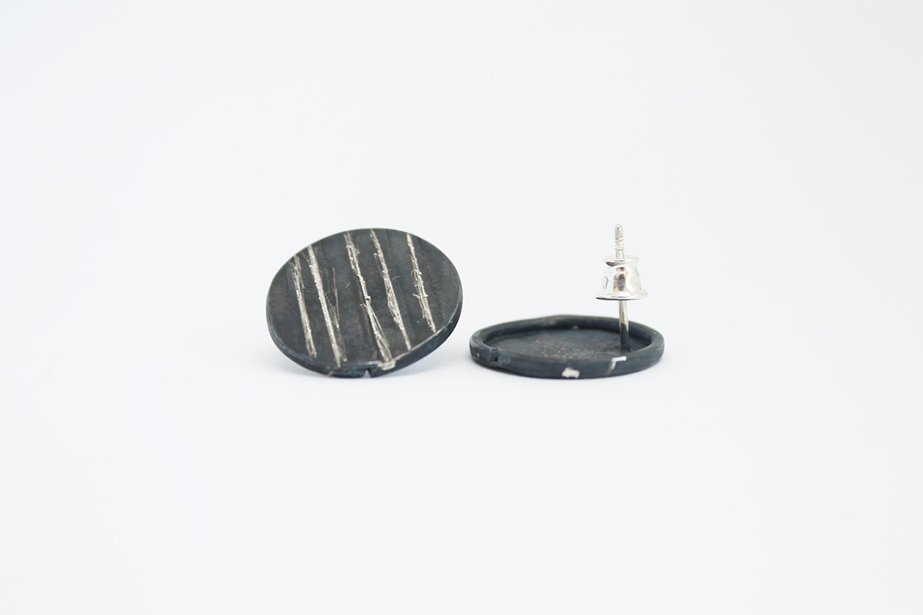 Round black silver stud earrings