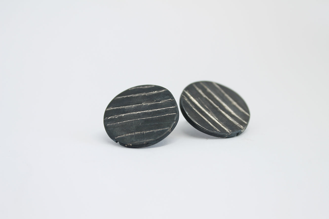 Round black silver stud earrings