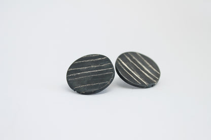 Round black silver stud earrings
