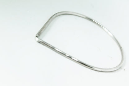 Mono silver teardrop bangle